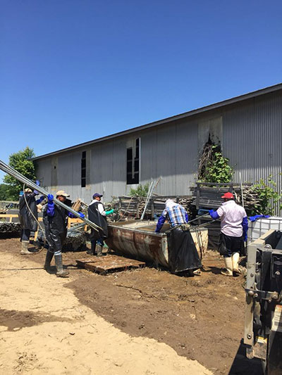 men sanitizing stakes