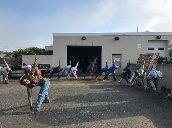 men stretching before a days work