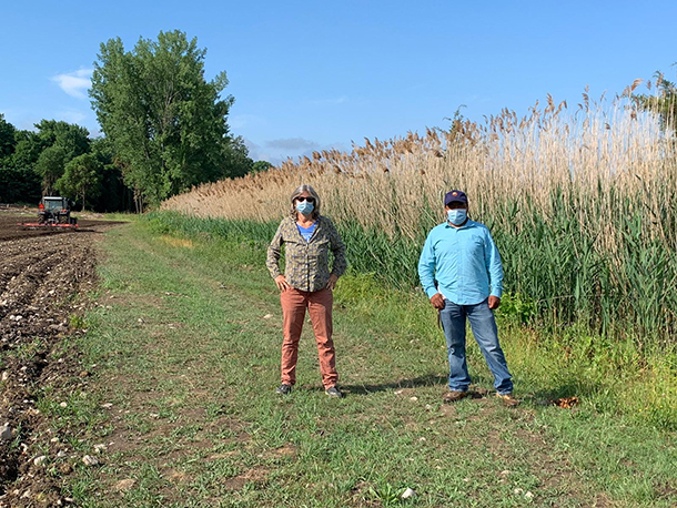 amy and juan in field