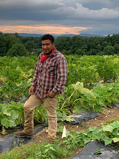 man in squash field